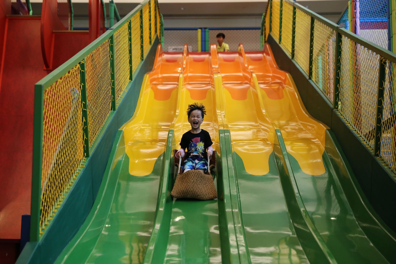 Bright indoor play gym with a colorful slide