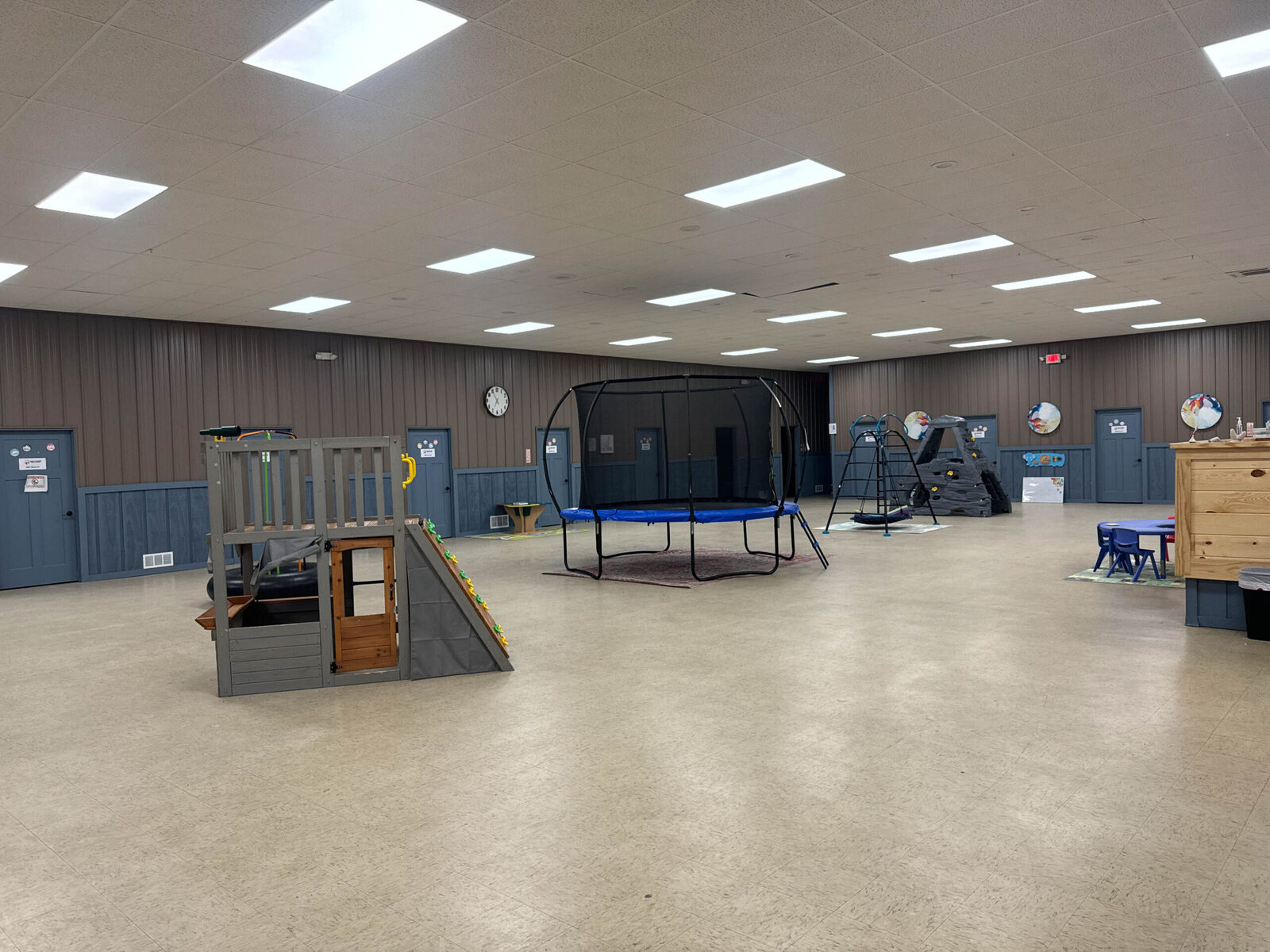 A large, open Game Changer clinic gym with trampolines, ramps and play structures