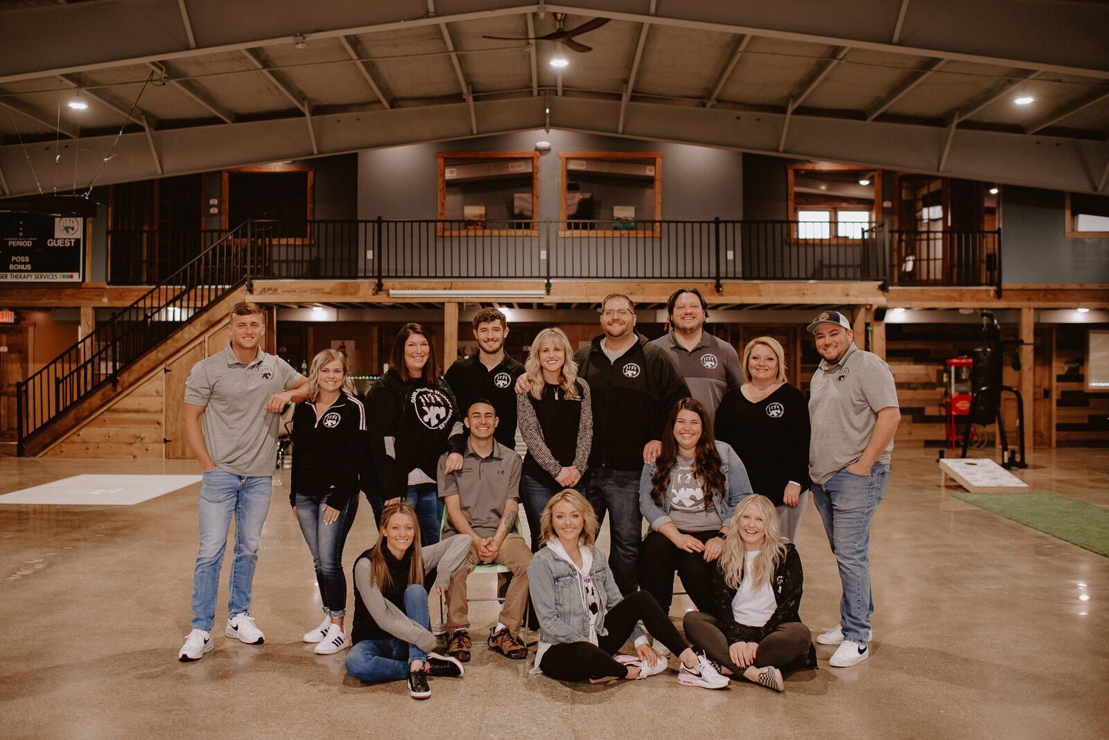 The full Game Changer Therapy staff posed together in a clinic gym