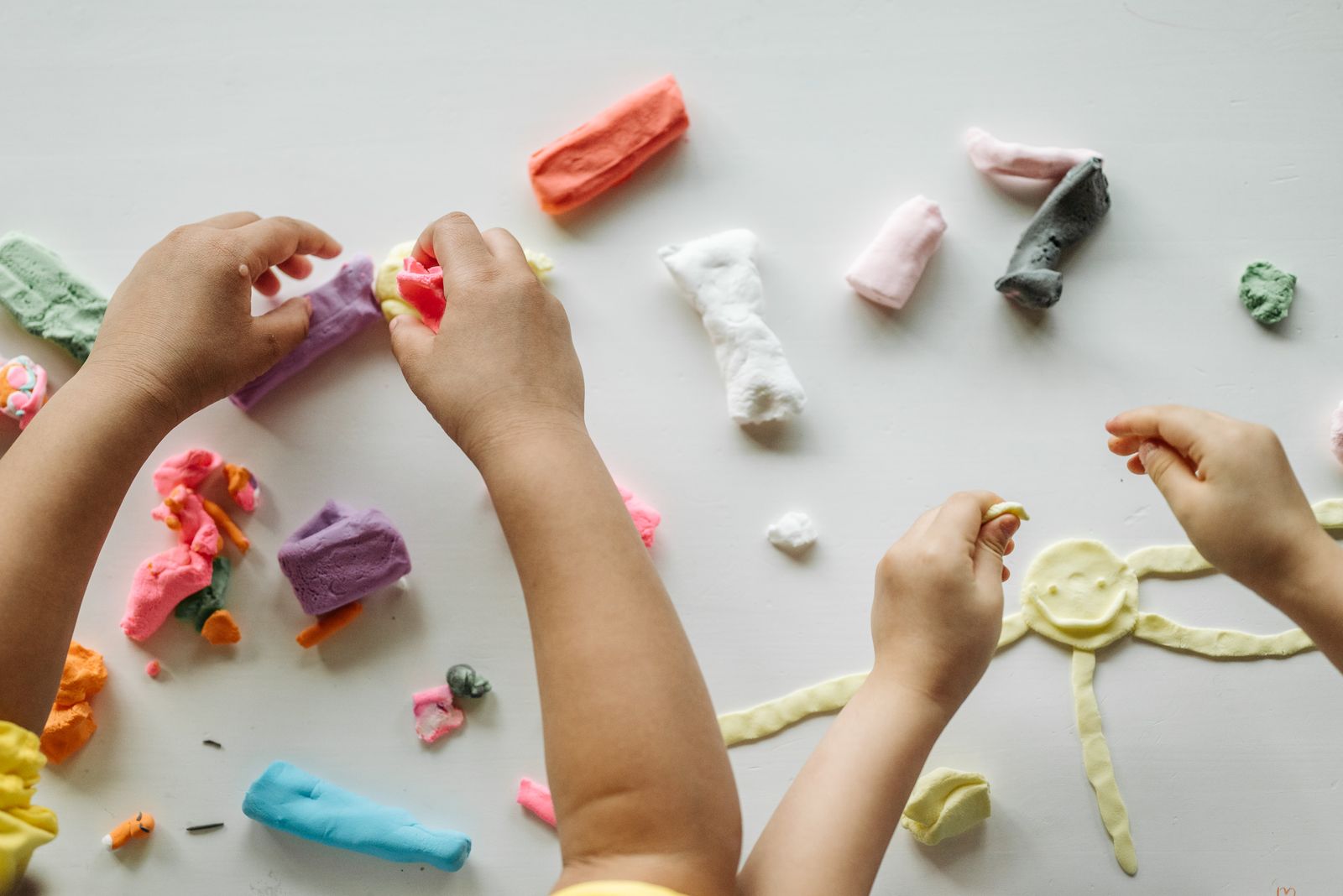 Children shaping and molding colorful clay during a hands-on activity